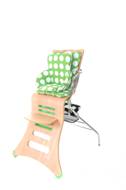 k1 beech with lime patterned cushion and booster seat