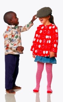 boy wearing aunty ollie shirt touching hat of girl wearing aunty ollie top