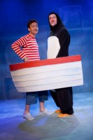 The Boy and the penguin take to the sea together in their boat