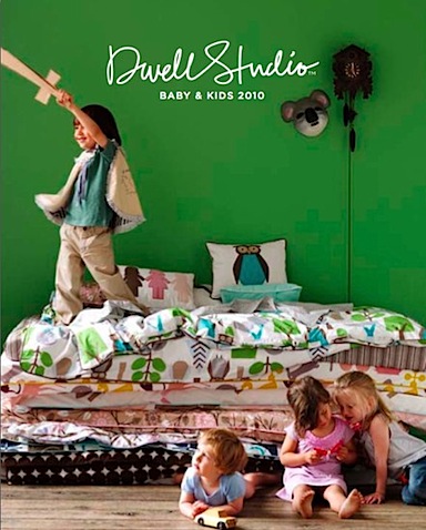 dwell studio 2010 collection showing kids jumping on the bedding